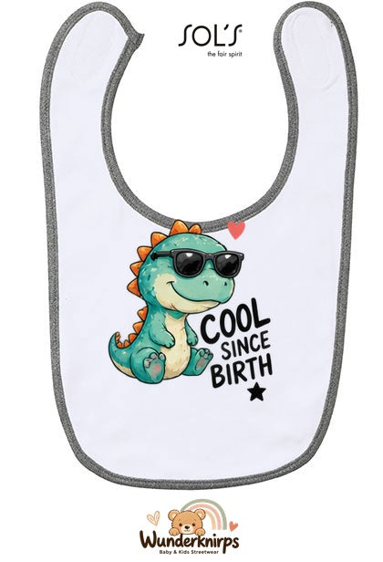 Baby-Lätzchen SOL’S Babib in Weiß / Grau meliert mit Motiv Cool since Birth – Dino