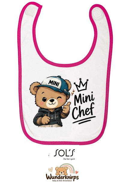 Baby-Lätzchen SOL’S Babib in Weiß / Fuchsia mit Motiv Mini Chef – Bär