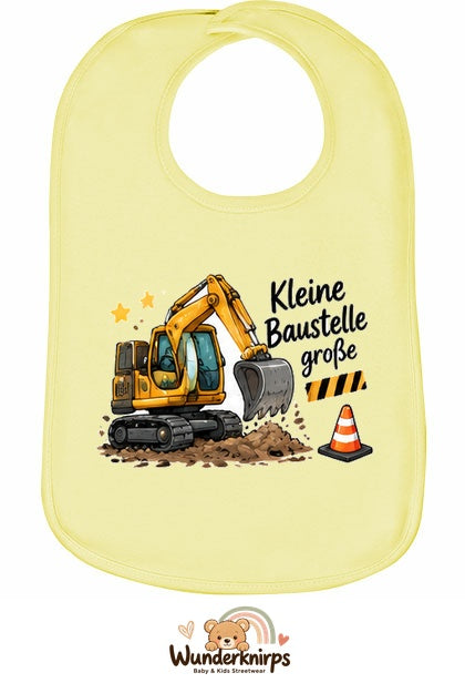 Baby-Lätzchen Olli-01 in Pastellgelb mit Motiv Kleine Baustelle, große Pläne