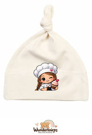 Knotenmütze Babybugz BZ15 in Natur mit Motiv Bäckerin mit Cupcake