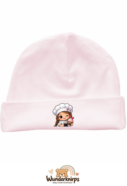 Umschlagmütze Rox-01 in Pastellrosa mit Motiv Bäckerin mit Cupcake