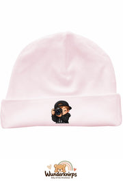 Umschlagmütze Rox-01 in Pastellrosa mit Motiv Fotograf mit Kamera