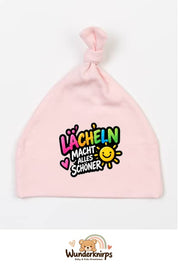 Knotenmütze Babybugz BZ15 in Pastellrosa mit Motiv Lächeln macht alles schöner