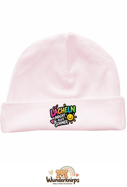 Umschlagmütze Rox-01 in Pastellrosa mit Motiv Lächeln macht alles schöner