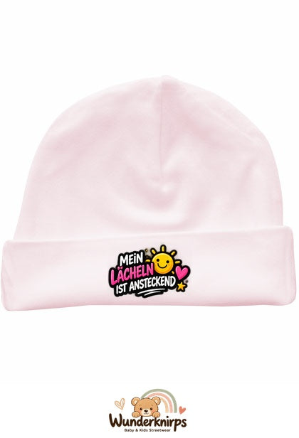 Umschlagmütze Rox-01 in Pastellrosa mit Motiv Mein Lächeln ist ansteckend