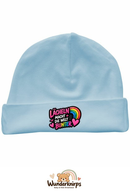 Umschlagmütze Rox-01 in Pastellblau mit Motiv Lächeln macht die Welt bunter