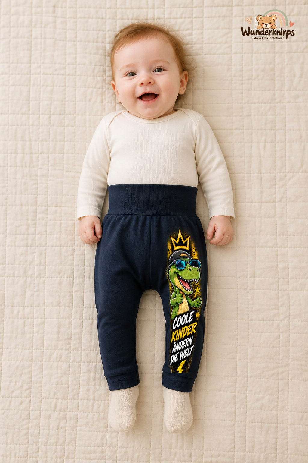 Dino Lieblingslook – Coole kinder ändern die welt – Babyhose für Mädchen: Navy mit Dino-Druck am Hosenbein – Wunderknirps.