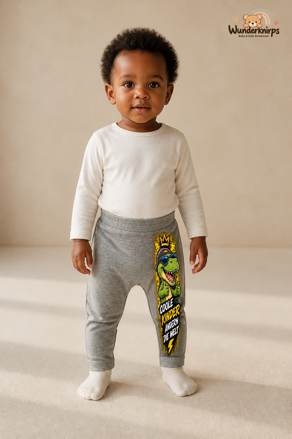 Kleine Weltentdeckerin: Coole kinder ändern die welt – Babyhose für Mädchen: Grau meliert mit Dino-Druck am Hosenbein – Wunderknirps.