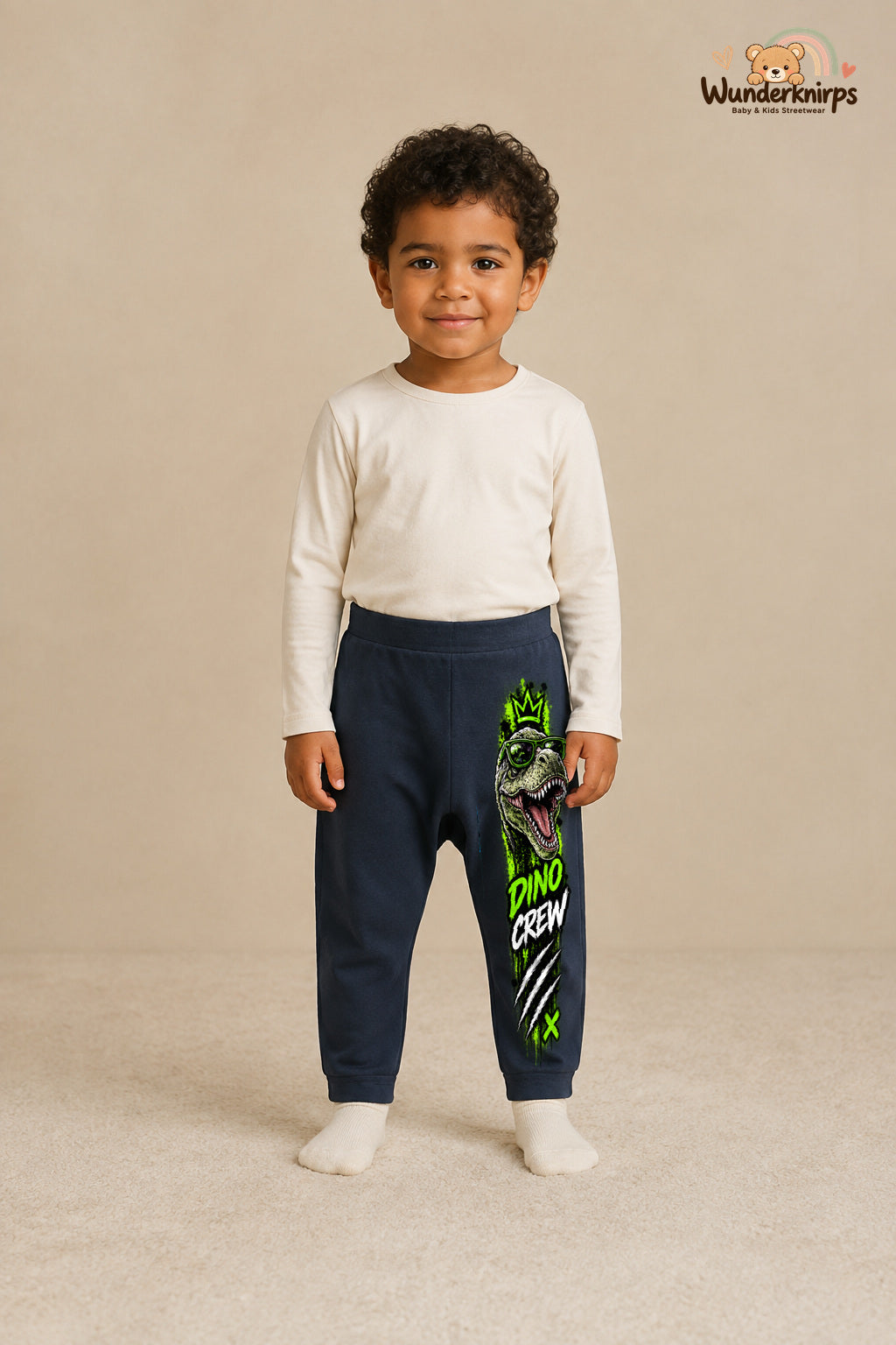 Dino crew: Dino für kleine Entdecker – Babyhose für Jungen: Navy mit Dino-Druck am Hosenbein – Wunderknirps.