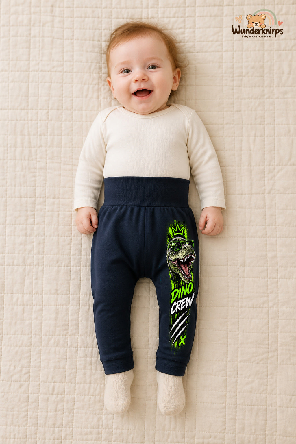 Dino crew – Dino mit Persönlichkeit – Babyhose für Mädchen: Navy mit Dino-Druck am Hosenbein – Wunderknirps.