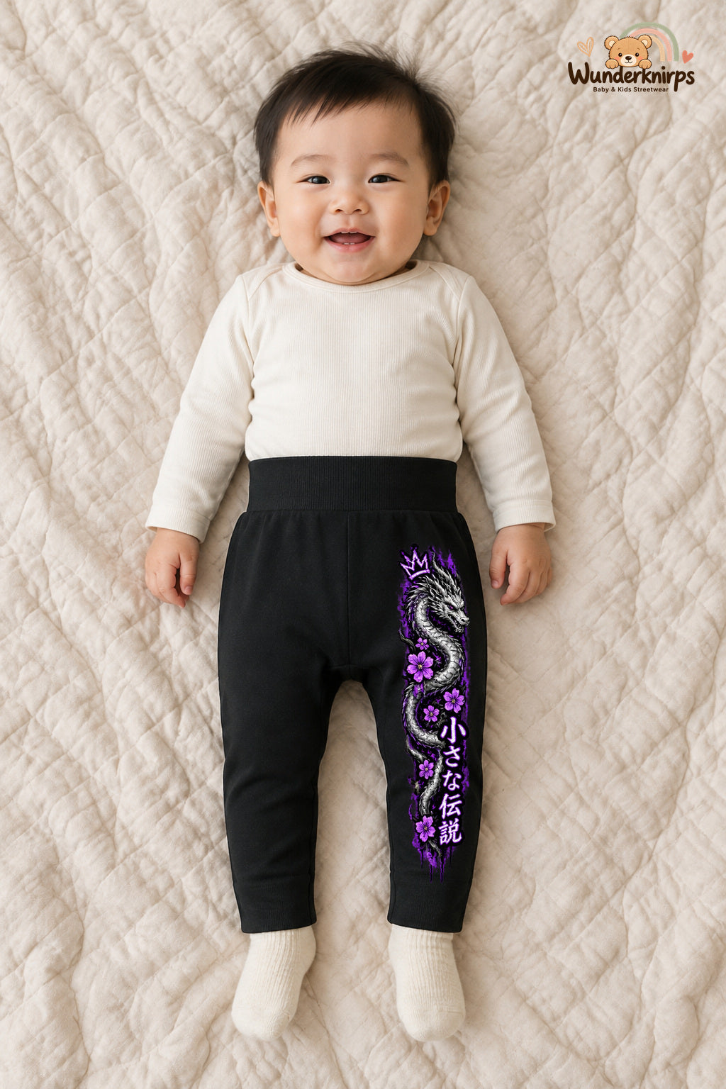 Drachenmotiv Statement – Babyhose mit dem Motiv Drachenmotiv – für Jungen: Schwarz mit Drachenmotiv-Druck am Hosenbein – Wunderknirps.