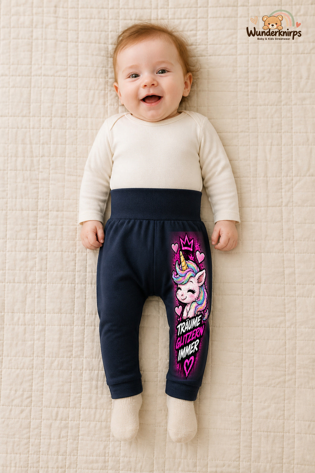 Einhorn Traumlook – Träume glitzern immer – Babyhose für Mädchen: Navy mit Einhorn-Druck am Hosenbein – Wunderknirps.