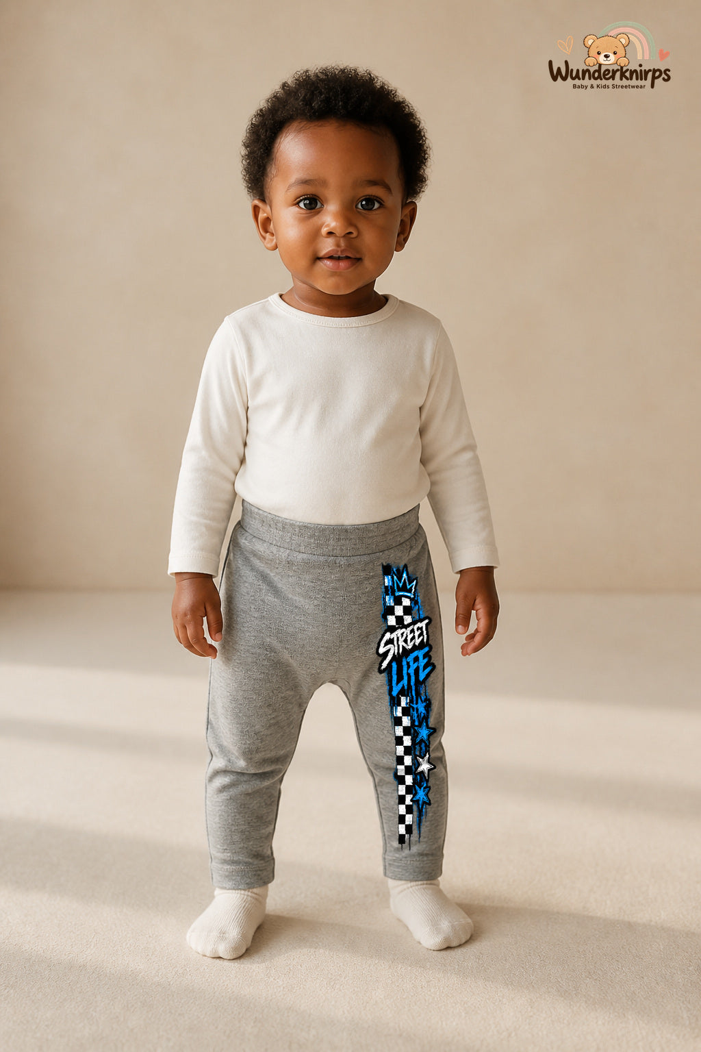 Karomuster Traumlook – Street life – Babyhose für Mädchen: Grau meliert mit Karomuster-Druck am Hosenbein – Wunderknirps.