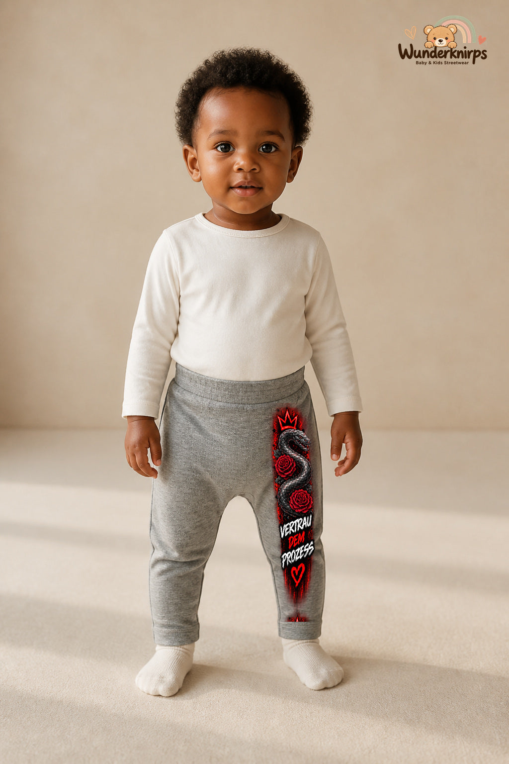 Schlange Traumlook – Vertrau dem prozess – Babyhose für Mädchen: Grau meliert mit Schlange-Druck am Hosenbein – Wunderknirps.
