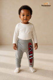Schlange Traumlook – Vertrau dem prozess – Babyhose für Mädchen: Grau meliert mit Schlange-Druck am Hosenbein – Wunderknirps.