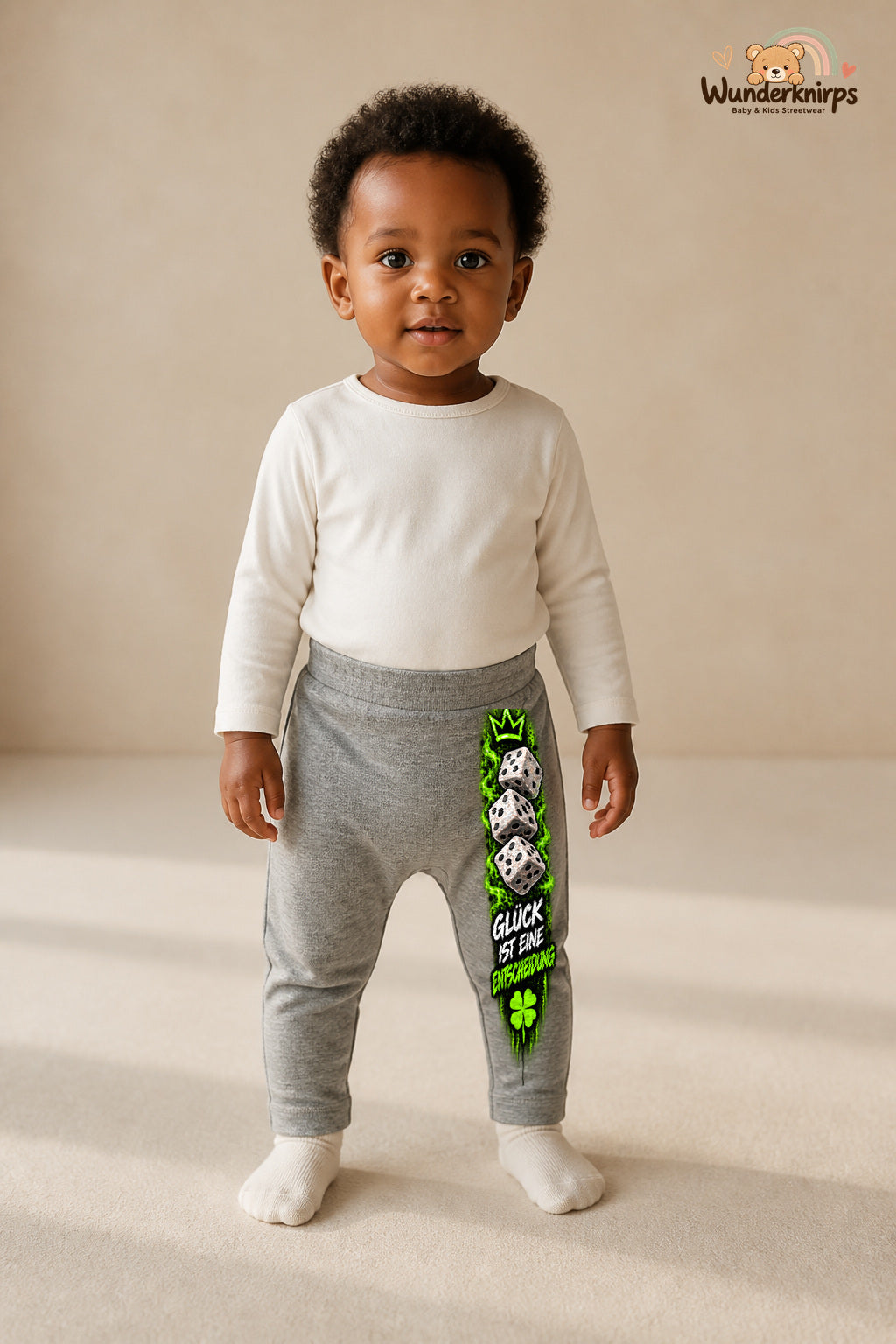 Kleine Weltentdeckerin: Glück ist eine entscheidung – Babyhose für Mädchen: Grau meliert mit Würfel-Druck am Hosenbein – Wunderknirps.
